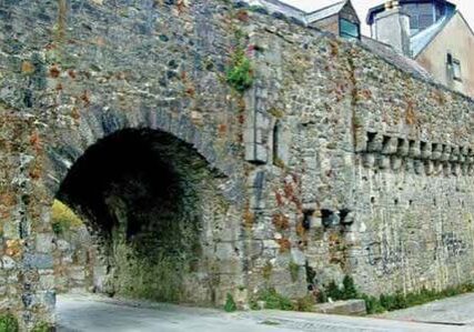 Stone archway and ancient wall structure.