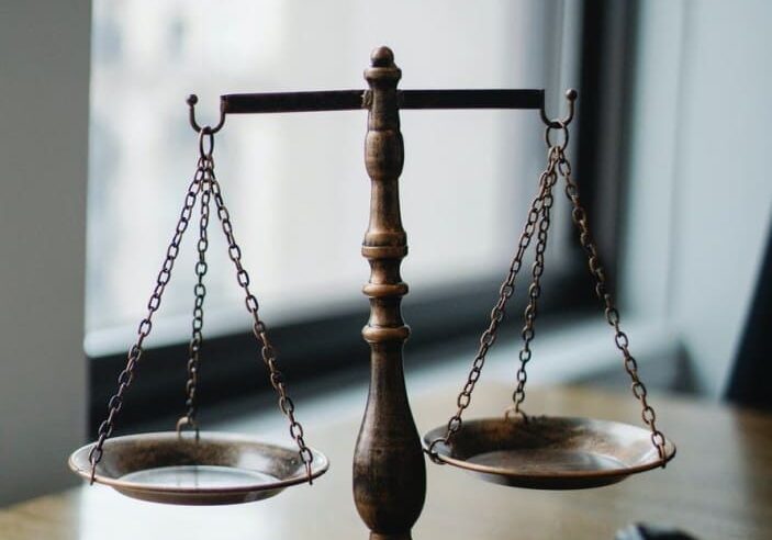 Brass scales of justice with gavel
