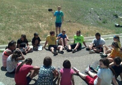 Group of kids sitting in a circle.